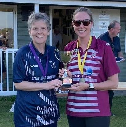 Kath Adams (nee Huxley) prersents the trophy to Chrissie Toy